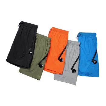 Летние мужские спортивные шорты прямого нейлонового свободного кроя, быстросохнущие пляжные брюки, пятиточечные шорты для мужчин